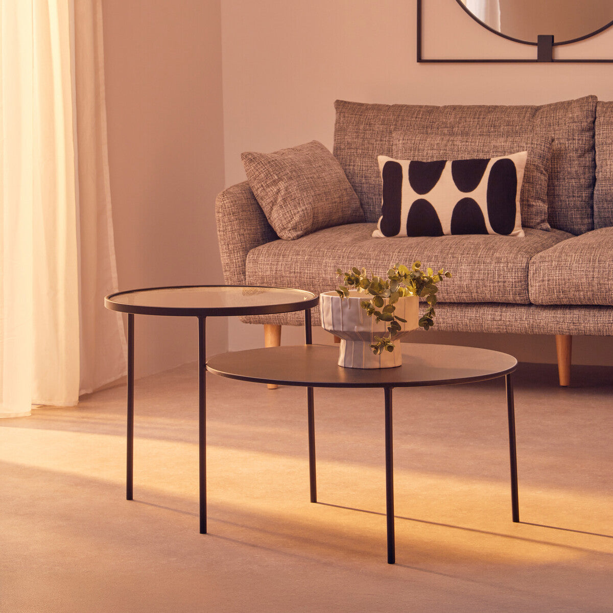Modern black metal trento coffee table with round glass tops and a lower level for versatile use