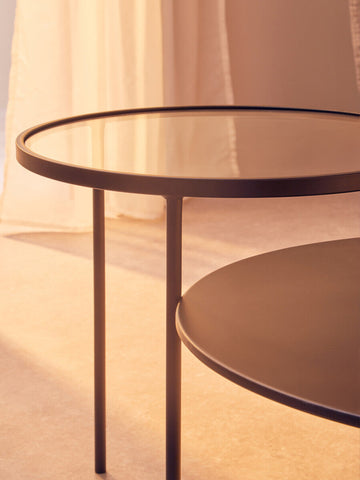 Modern trento coffee table with glass and metal tops featuring a sleek black frame and a lower level shelf for storage