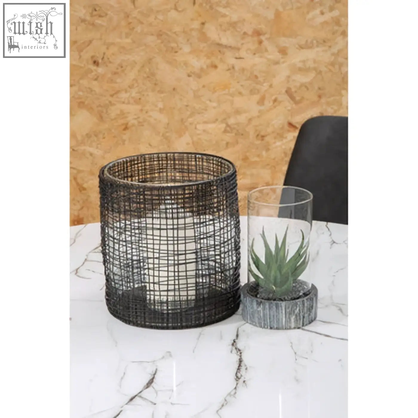 Black woven wire trento cylindrical lantern with a sleek cylindrical lantern design perfect for indoor or outdoor use