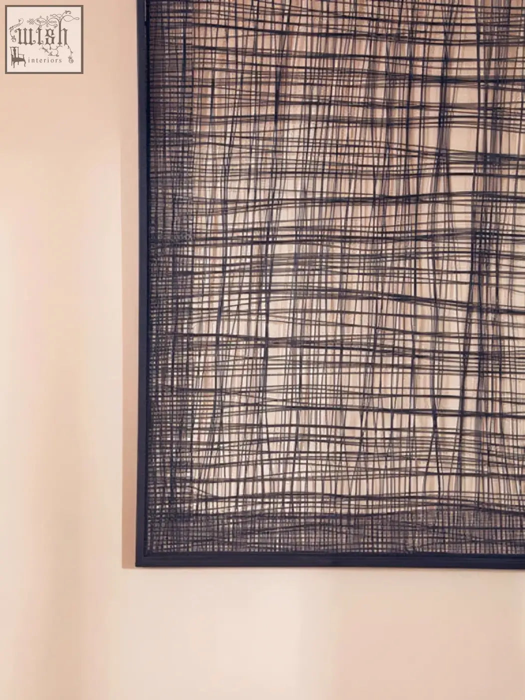 Black woven metal cross wires wall art with a grid pattern featuring a cross wires design for modern decor