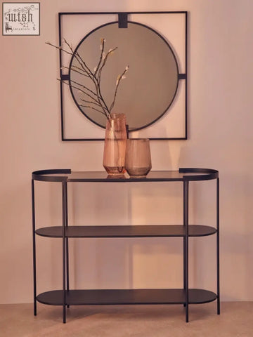 Small square black metal console table with three oval shelves and glass top in black metal frame style