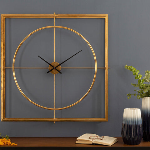 Trinity metal wall clock with gold-toned geometric metal wall design and minimalist black hands for stylish decor
