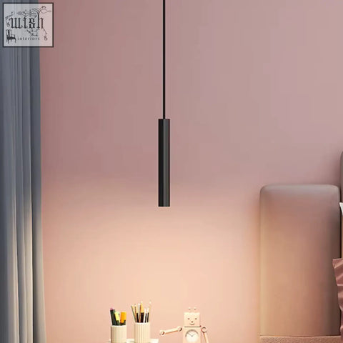 Black pendant light with sleek cylindrical design perfect for adjustable minimal bedroom lighting