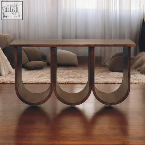 Modern triple open style coffee table with smooth rectangular top and curved dark legs made of solid mango wood chestnut color