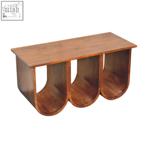 A chestnut solid mango wood coffee table with a triple open style design and three curved compartments