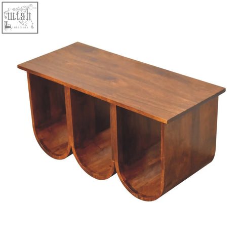 A chestnut solid mango wood triple open style coffee table with three curved compartments in medium brown wood