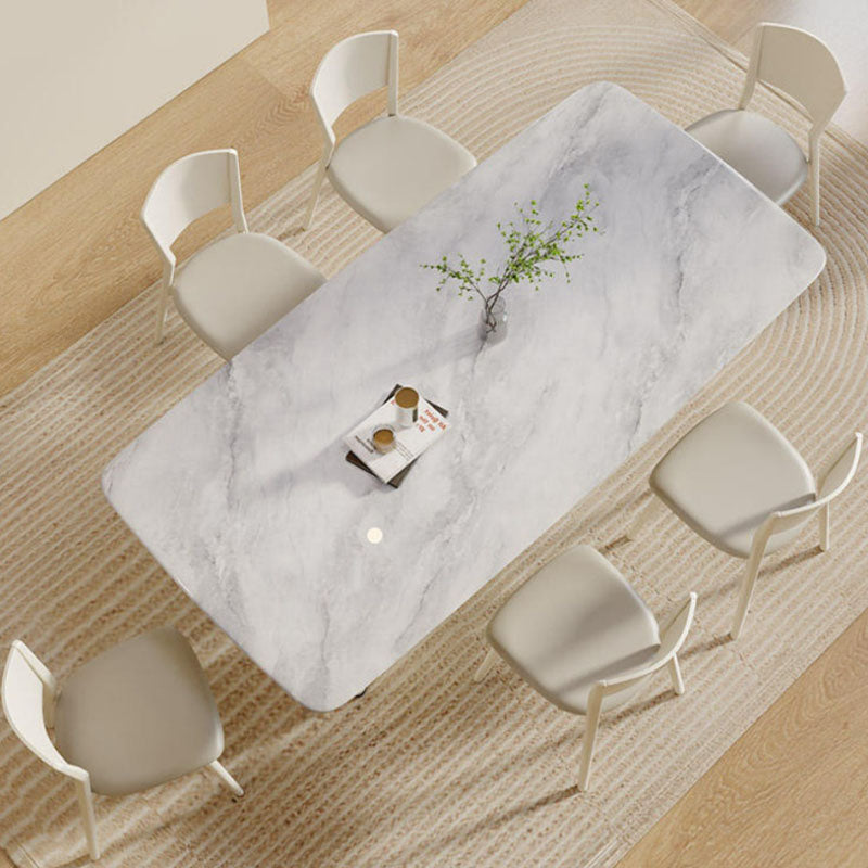 White marble trish dining table with sleek modern design and subtle gray veining perfect for dining room use