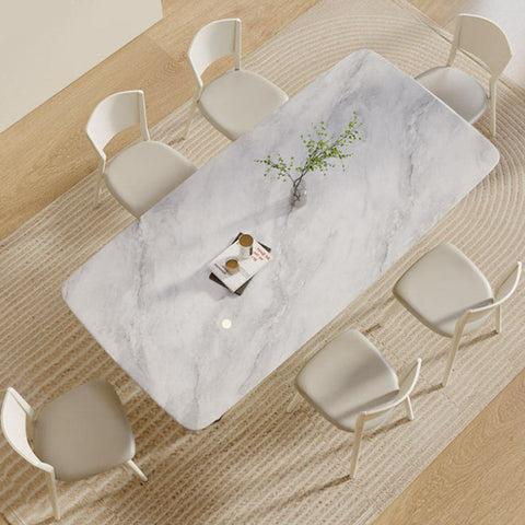 White marble trish dining table with sleek modern design and subtle gray veining perfect for dining room use