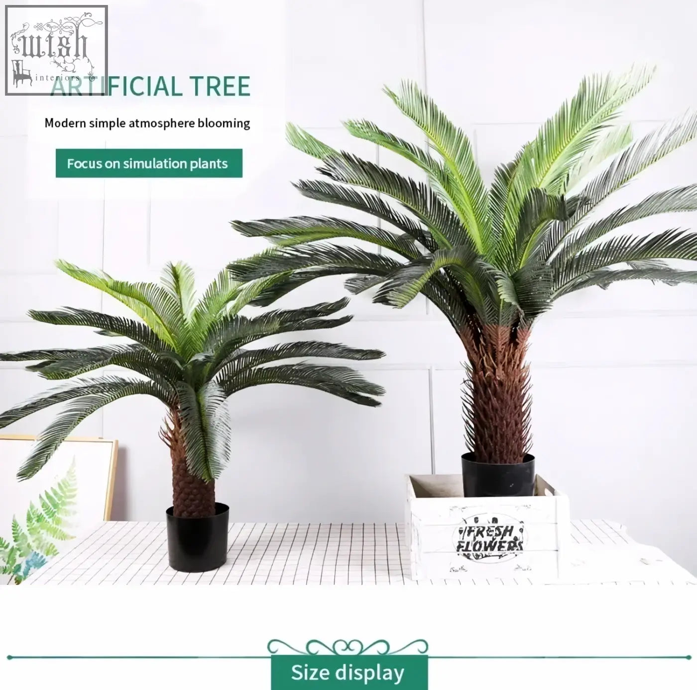 Two tropical artificial palm trees with green plastic palm leaves and brown trunks in black pot and white crate