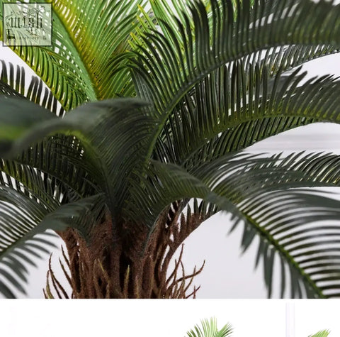 Artificial palm tree with textured brown trunk and detailed green plastic palm leaves for tropical decor