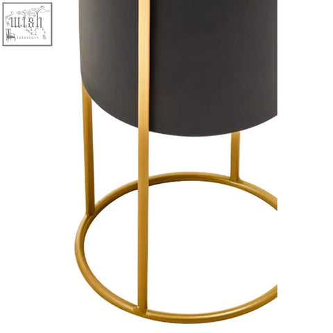 Trosa small black floor standing planter with a cylindrical design and gold-toned metal legs for modern decor