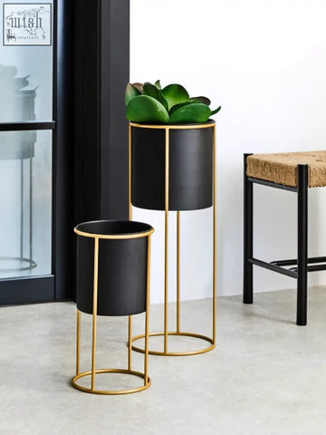 Trosa small black floor standing planter with cylindrical planter and gold metal frame for indoor plants