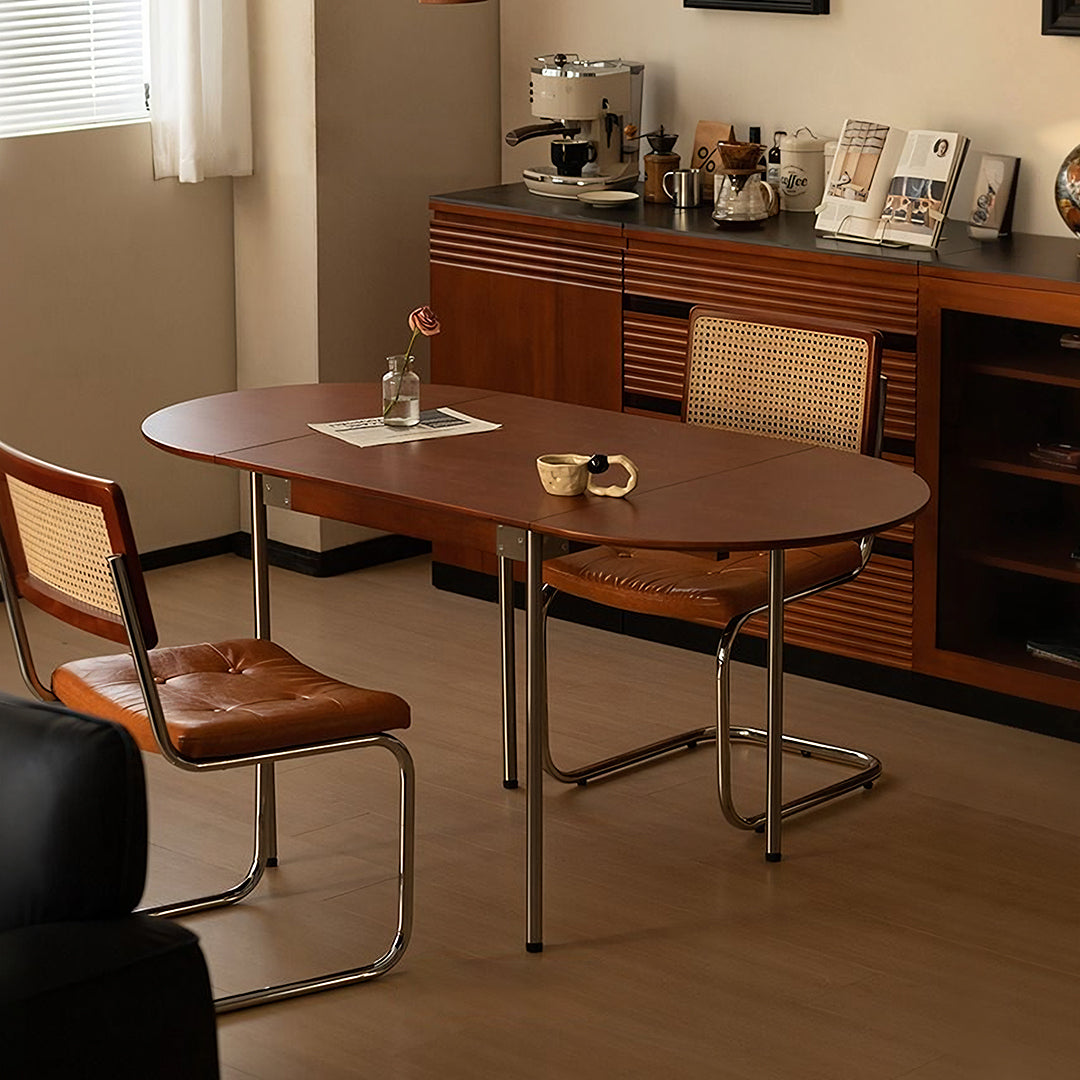 Brown oval tsvetkov foldable dining table with smooth solid wood top and sleek chrome legs for easy foldable dining use