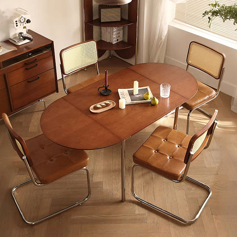 Brown solid wood oval tsvetkov foldable dining table with sleek extendable design and chrome legs