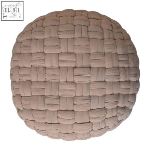 Beige woven fabric tube pouffe with textured interlaced pattern perfect as a cream footstool sphere
