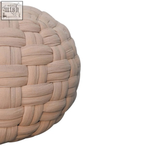 Beige woven rattan tube pouffe with a tight interlaced pattern perfect as a cream footstool