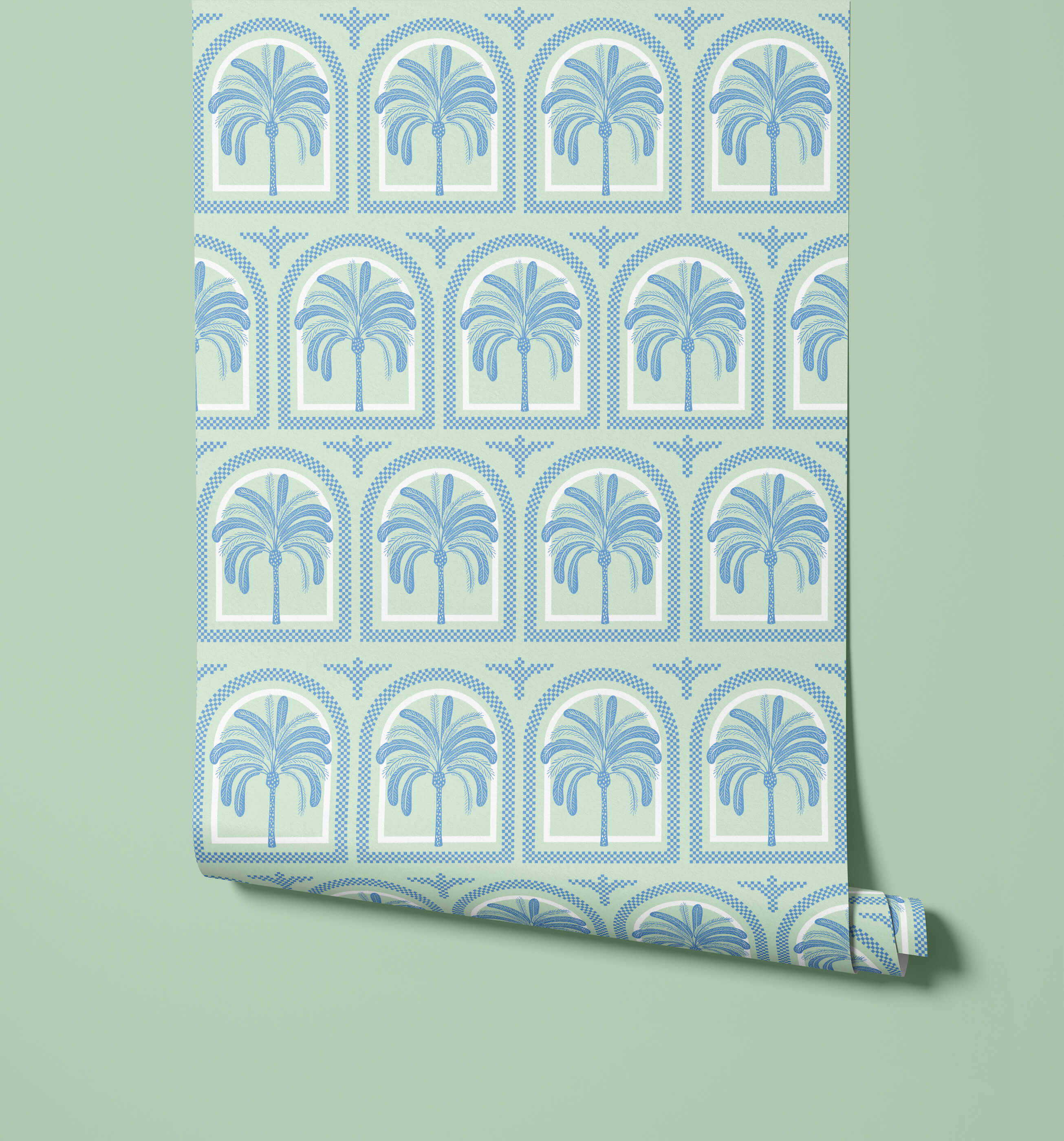 A roll of tucci mint green wallpaper with a repeating blue palm tree pattern in arched frames perfect for walls