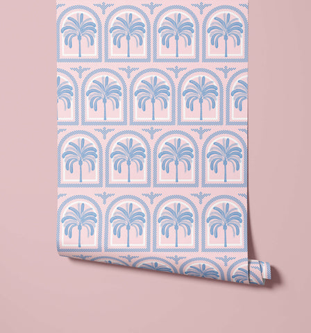 Pink tucci wallpaper with a blue palm tree pattern framed in decorative arched borders for stylish walls