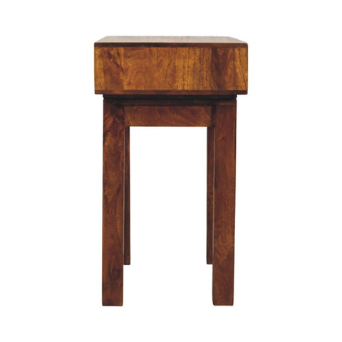A rustic chestnut writing desk featuring a warm brown wooden finish and a single drawer for storage