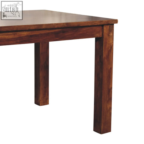 Tula dining table in chestnut solid mango wood with rich dark brown finish and natural grain patterns