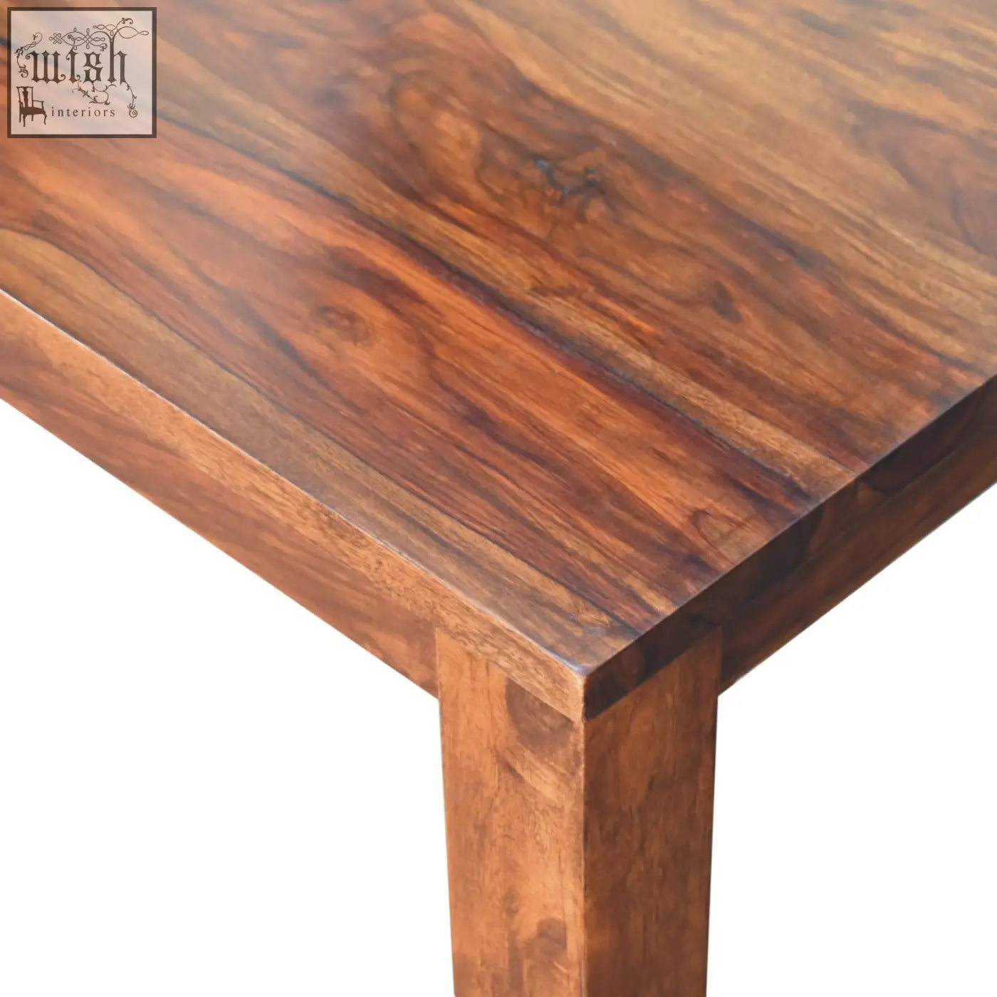 Rich dark brown tula dining table made of chestnut solid mango wood with smooth polished surface and natural grain patterns