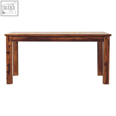 Solid mango wood tula dining table in chestnut finish with warm brown color and natural grain patterns visible