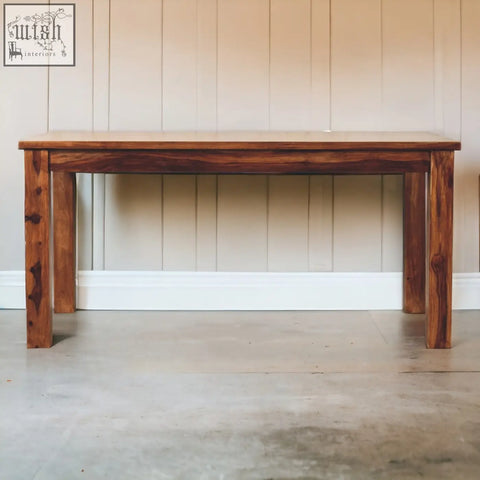 Tula dining table in chestnut solid mango wood with warm brown finish and natural grain patterns