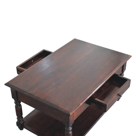 Dark brown wooden coffee table with turned legs, two side drawers, and a lower shelf for extra storage