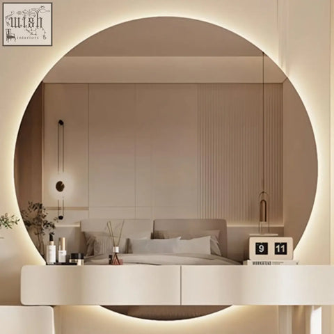 Circular vanity mirror with soft glowing led ring and minimalist white frame on cream turner dressing table