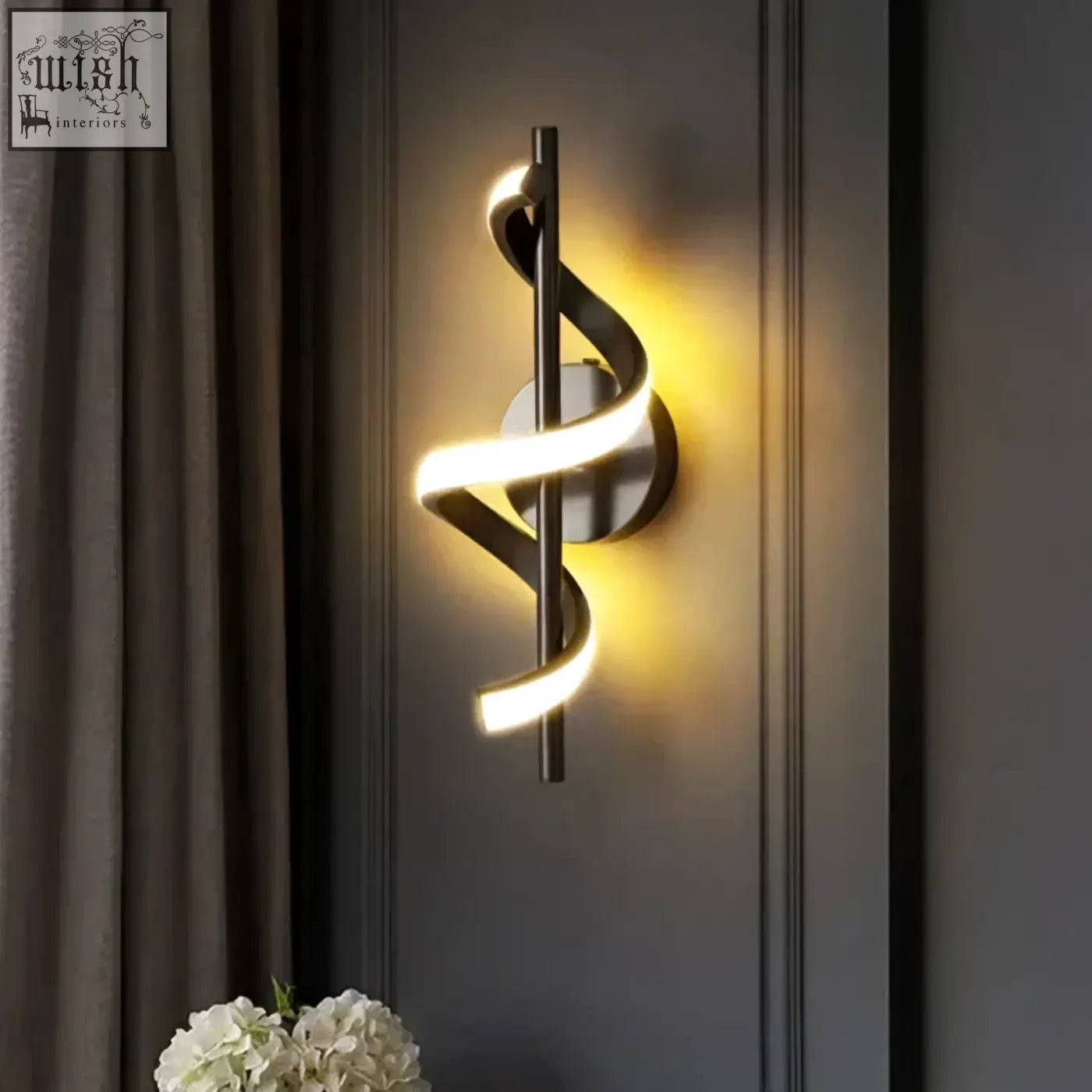 Modern minimalist twisted led wall light in black and gold with sleek metallic design and warm led lighting for living room
