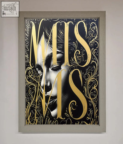 A typography queen framed poster with a black and white woman portrait and gold lettering on a dark background