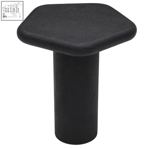 Black udaipur pentagon side table with hexagonal top and matte textured finish featuring organic shape base