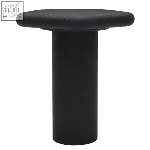 Black udaipur pentagon side table with textured finish and organic shape featuring an octagonal top and cylindrical base