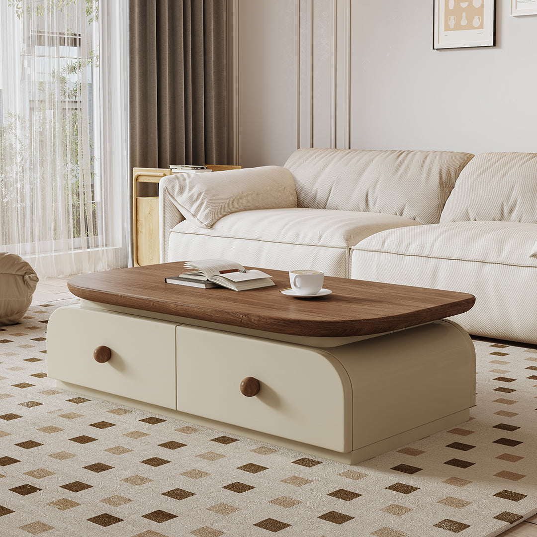 Cream-colored uddin rectangle coffee table with smooth rounded wooden top and two drawers with round brown knobs