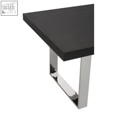 Ulmus dining table with black matte tabletop and sleek chrome-plated rectangular legs for stylish dining