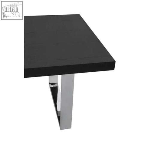 Black ulmus dining table with glossy finish and sleek chrome legs perfect for modern dining spaces