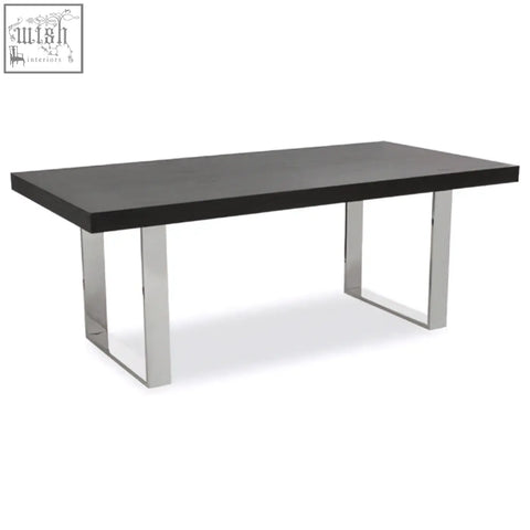 Black ulmus dining table with sleek chrome legs perfect for modern dining spaces