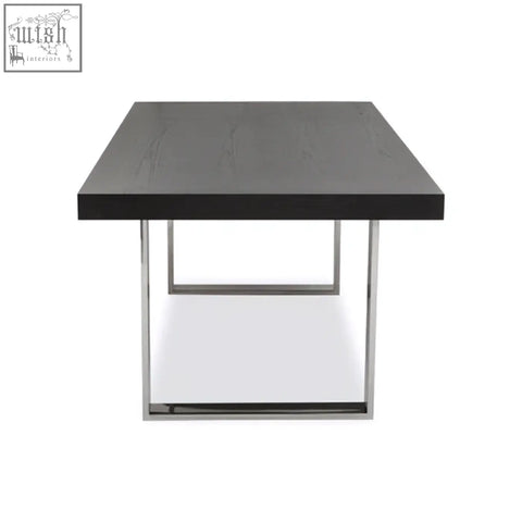 Black ulmus dining table with sleek chrome metal legs perfect for modern dining spaces