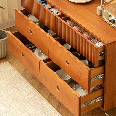 Light cherry wood una drawer sideboard with vertical slatted drawers and round metal pulls for stylish storage