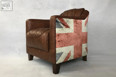 Brown leather union tub chair showing distressed union jack flag pattern on the backrest from behind