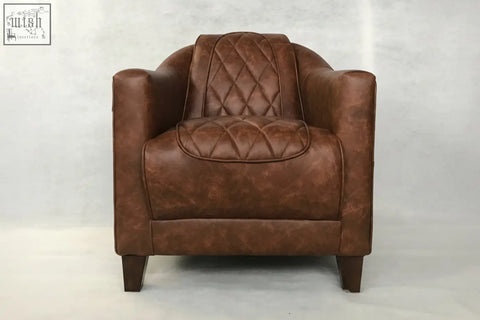 Brown leather union tub chair with quilted diamond stitching on back and seat for stylish seating