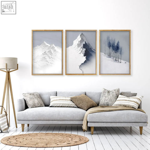 Three framed mountain landscape wall art prints with minimalist grey white blue watercolor in light wood for living room