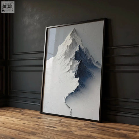 Black-framed wall art featuring a snow-capped mountain landscape with blue shading and a winding trail for living room decor