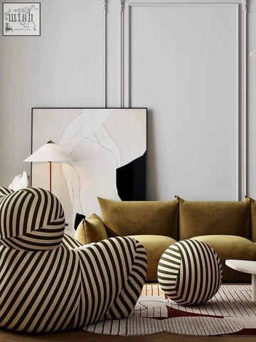 Up50 armchair lounge chair with bold black and cream stripes and a rounded sculptural design