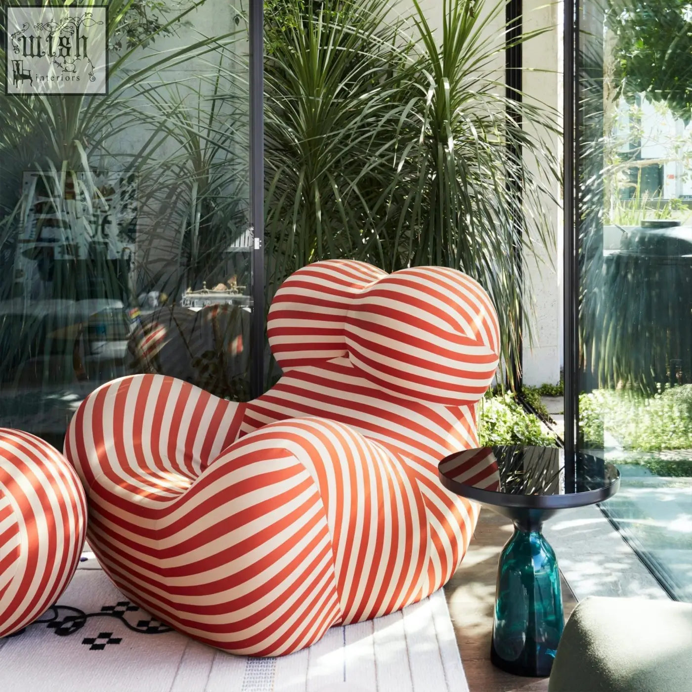 Up50 armchair lounge chair with plush organic shape and bold red and white diagonal stripes upholstery