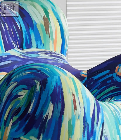 Up50 armchair with a ball stool in b&b italia style featuring bold abstract fabric in blue teal green and cream