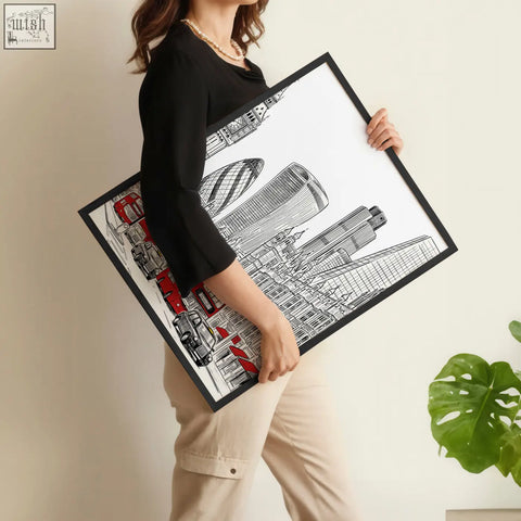 Black-framed urban artwork featuring london skyline and bold red double-decker buses wall art print set of 2