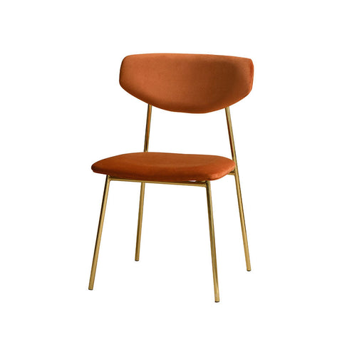 Urban dining chair with plush orange velvet seat and backrest on slim gold metal legs perfect for urban dining spaces