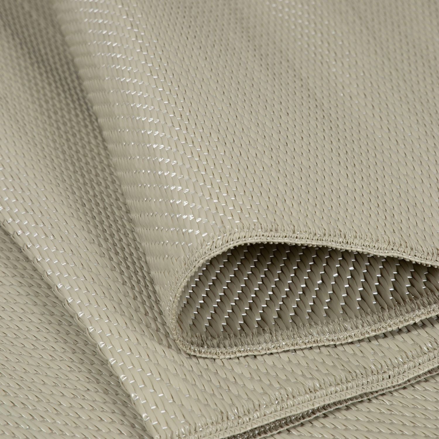 Beige woven fabric with subtle sheen and tight threads in urban outdoor rug beige perfect for outdoor use