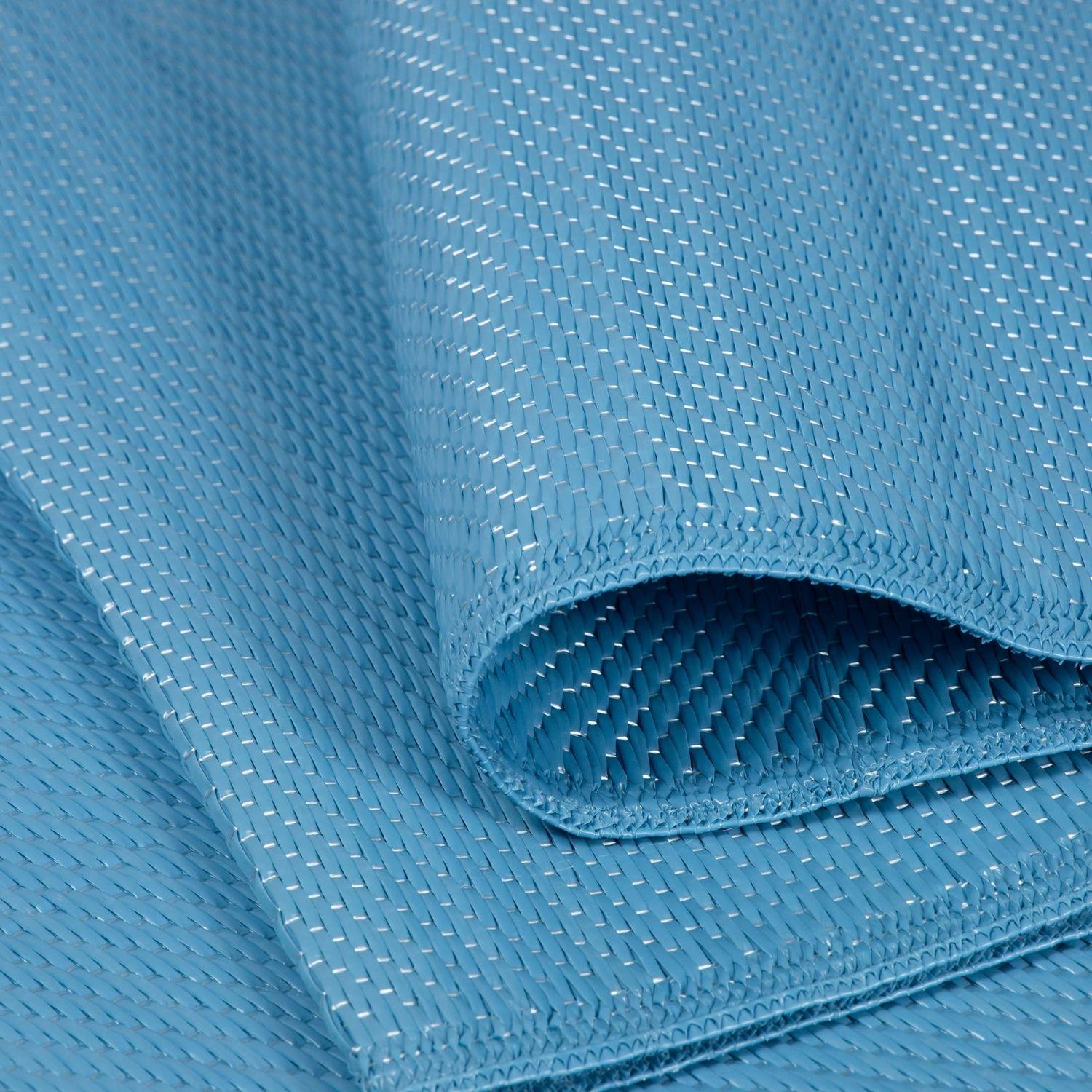 Light blue woven fabric with subtle texture on an urban outdoor rug blue perfect for outdoor use